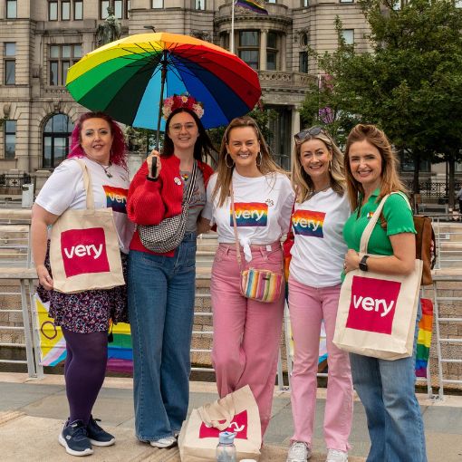 Five women wearing Pride tshirts